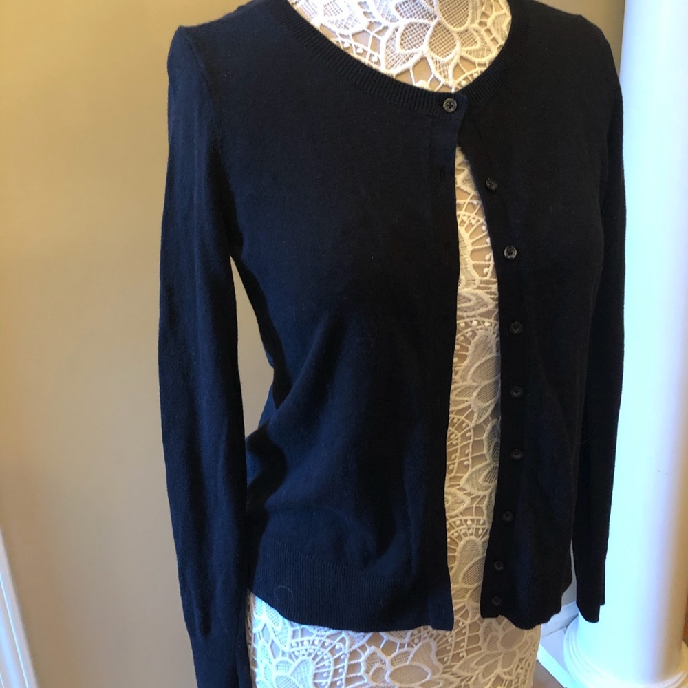 A button up navy sweater